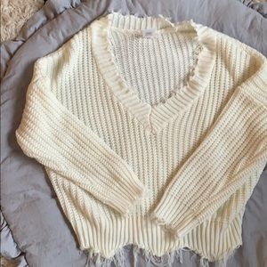 Cream distressed V neck sweater